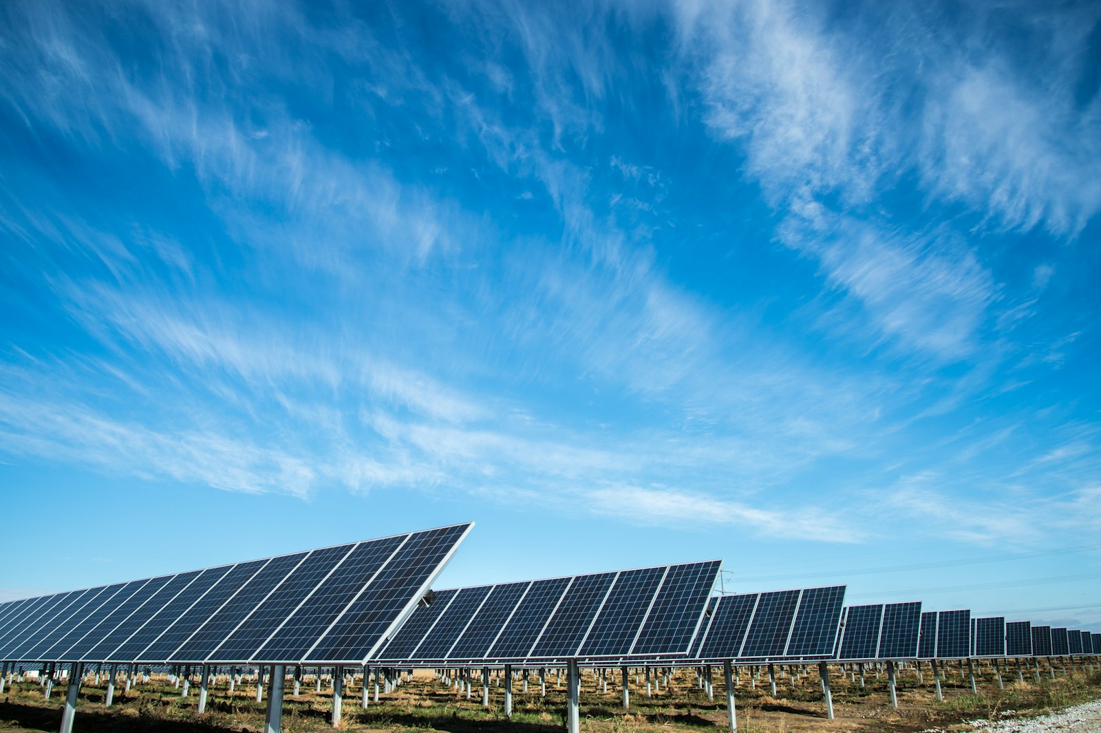 Solar farm under a bright sky